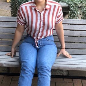 A pink and white striped button up shirt